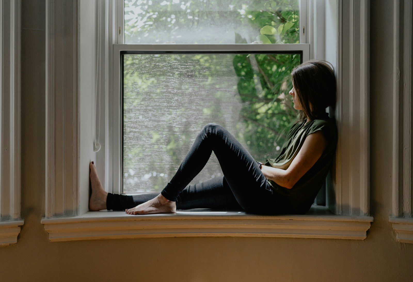 woman-sitting-window